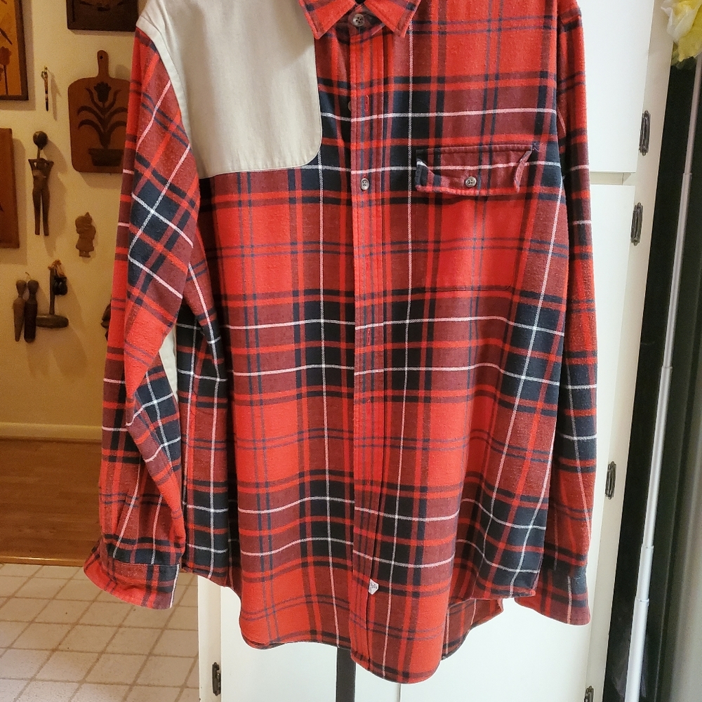 Flannel plaid shirt with gun patch shoulder and elbows.